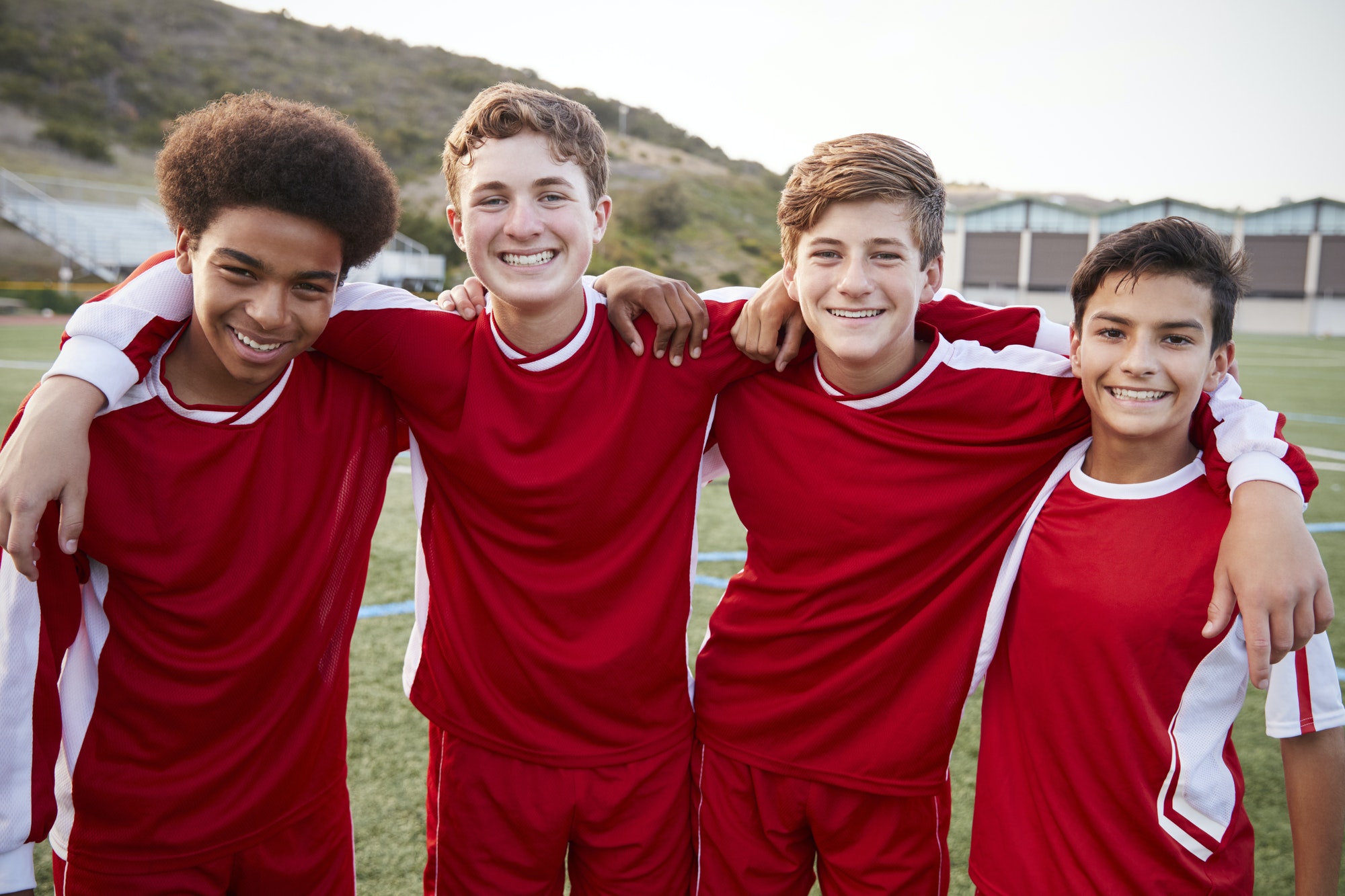 portrait-of-male-high-school-students-playing-in-soccer-team.jpg